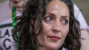 A close up image of Lubna Speitan looking to her side.
