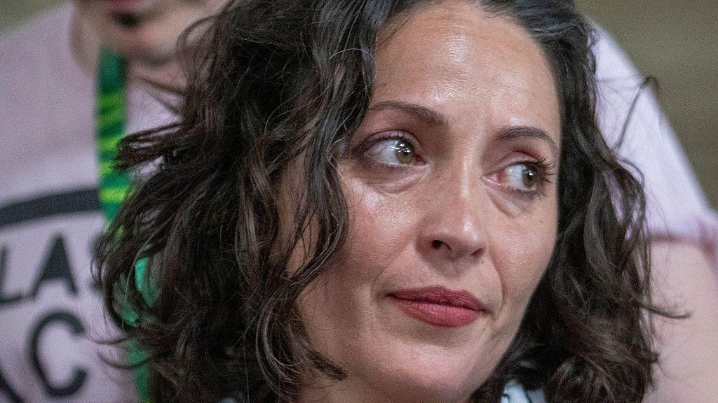 A close up image of Lubna Speitan looking to her side.
