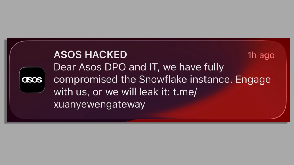 A screenshot of a notification from the Asos app sent to an iPhone user, headlined "ASOS HACKED". It says "Dear Asos DPO and IT, we have fully compromised the Snowflake instance. Engage with us, or we will leak it" and shares a link to a Telegram channel.