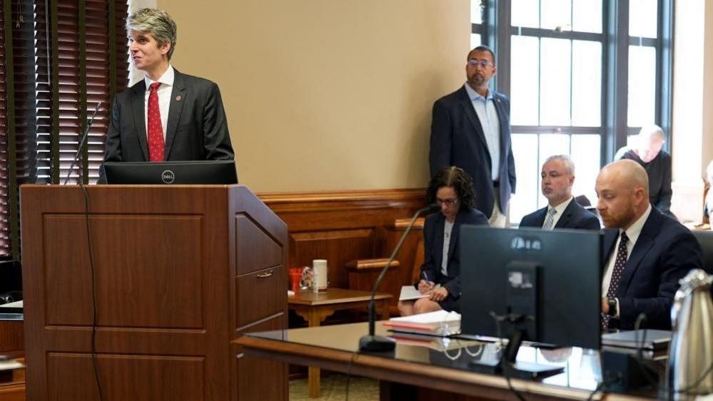 The lawyers seen in the courtroom