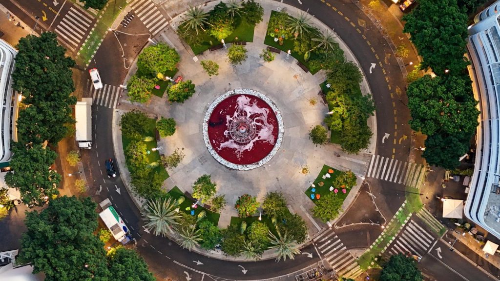 A drone view of the water of the fountain at Dizengoff Square stained red to symbolise blood,